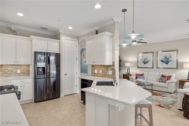 kitchen featuring white cabinetry, sink, and black appliances