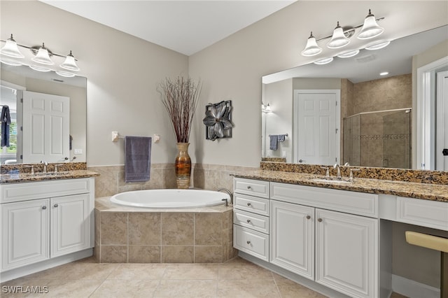 bathroom featuring separate shower and tub, tile patterned flooring, and vanity