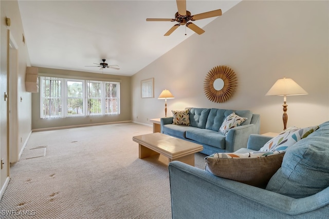 carpeted living room with ceiling fan and high vaulted ceiling