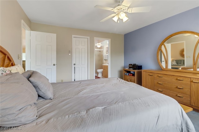 bedroom with a closet, ceiling fan, and connected bathroom