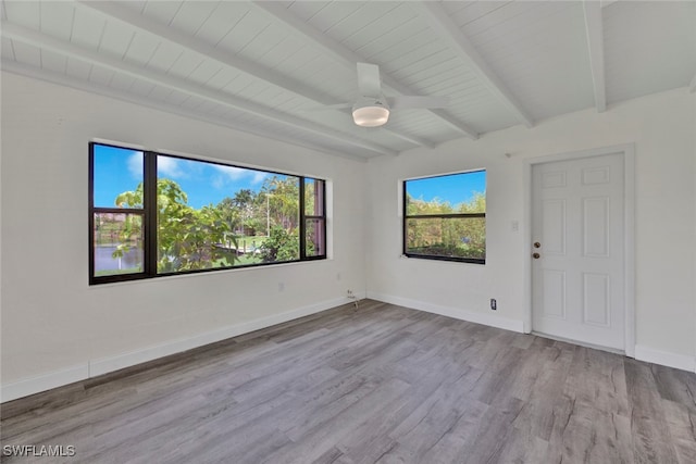 spare room with light hardwood / wood-style floors, beamed ceiling, ceiling fan, and wood ceiling