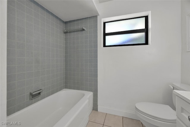 full bathroom with toilet, vanity, tiled shower / bath, and tile patterned floors