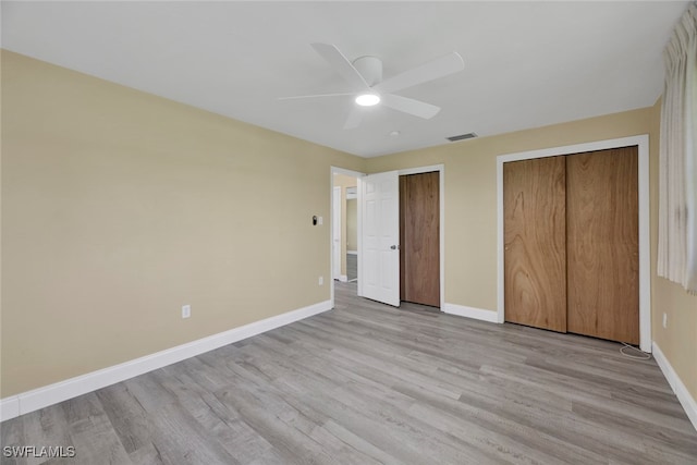 unfurnished bedroom with light hardwood / wood-style floors and ceiling fan