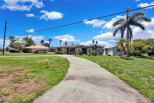 ranch-style home with a front lawn