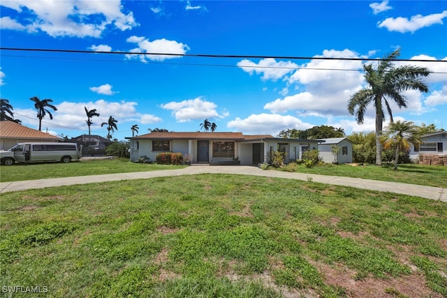 ranch-style home with a front lawn