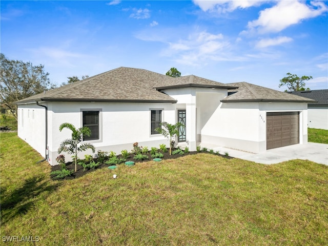 view of front of house with a front lawn and a garage