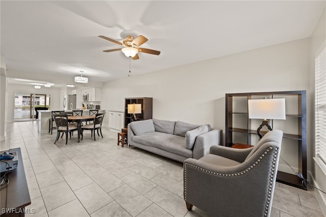 tiled living room featuring ceiling fan