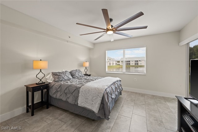 bedroom with multiple windows and ceiling fan