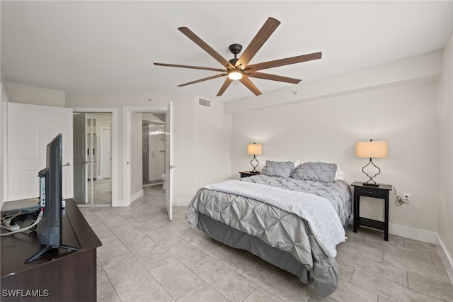 tiled bedroom featuring ceiling fan