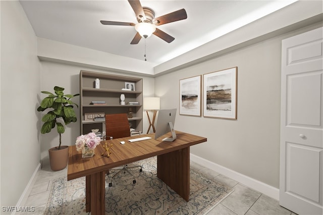 tiled office space featuring ceiling fan