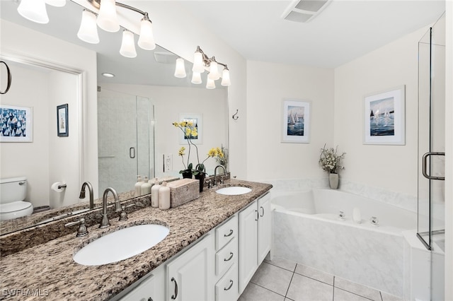 full bathroom with tile patterned floors, vanity, shower with separate bathtub, and toilet