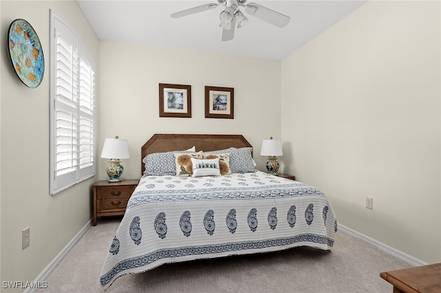 bedroom with light carpet and ceiling fan