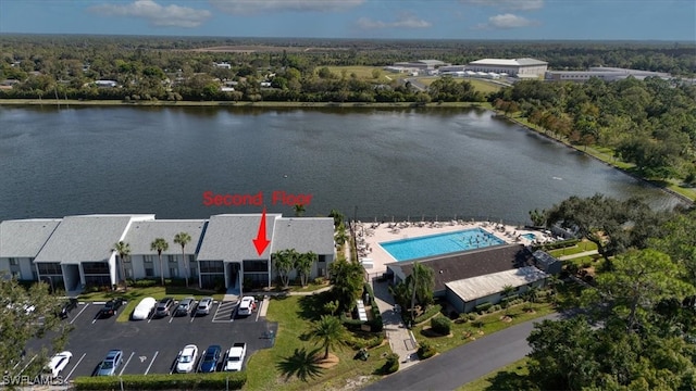 birds eye view of property featuring a water view