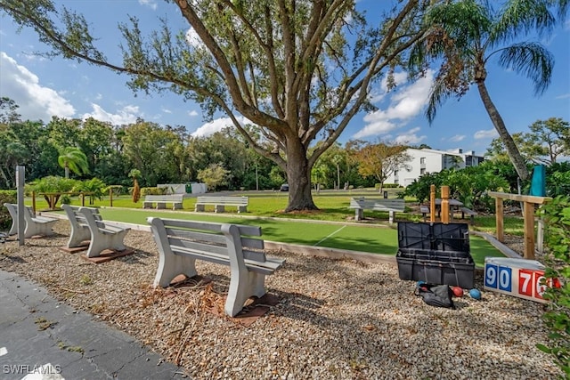 view of property's community featuring a yard