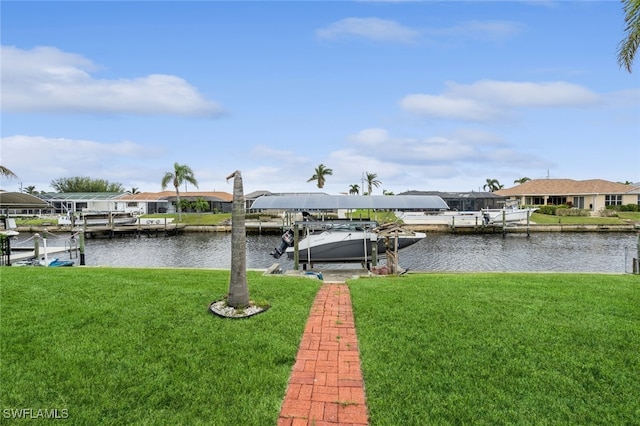 dock area featuring a water view and a lawn