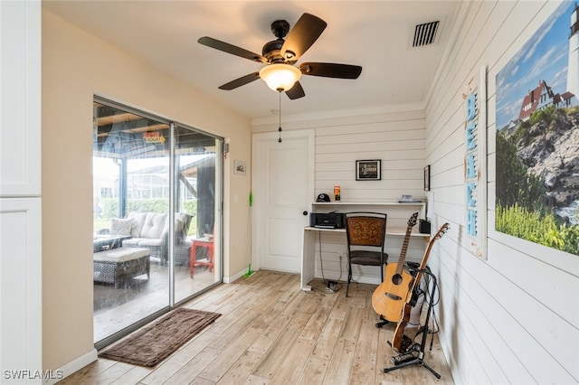 office with ornamental molding, light wood-type flooring, and ceiling fan