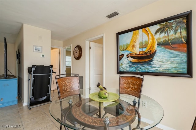 dining space featuring light tile patterned floors