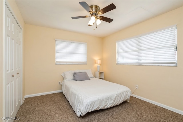 bedroom featuring a closet, ceiling fan, and carpet floors