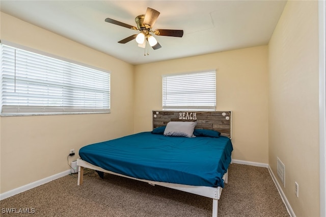 bedroom with ceiling fan and carpet floors