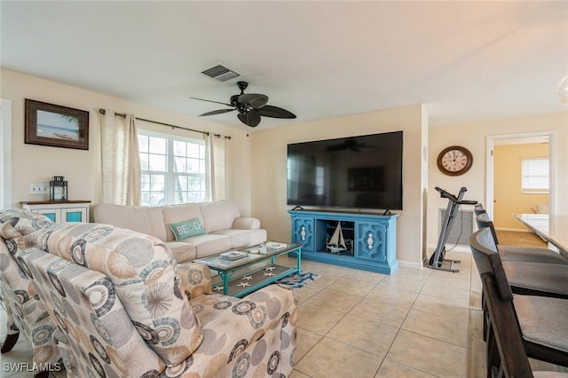 living room with light tile patterned floors and ceiling fan