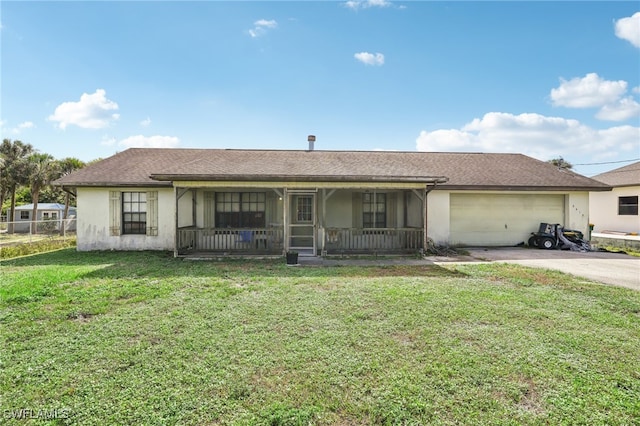 single story home featuring covered porch, a garage, and a front yard