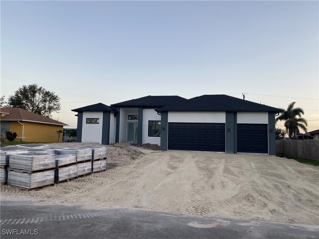 prairie-style house featuring a garage