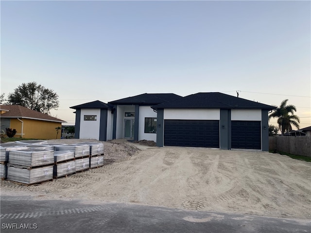 prairie-style house featuring a garage