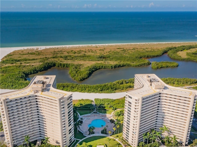 bird's eye view featuring a view of the beach and a water view