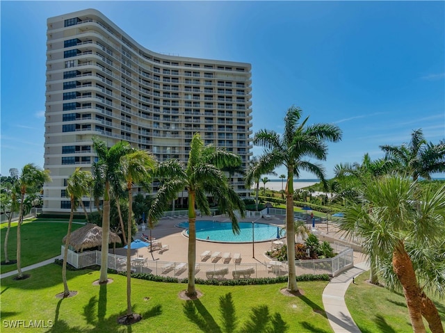 view of pool with a yard and a patio area