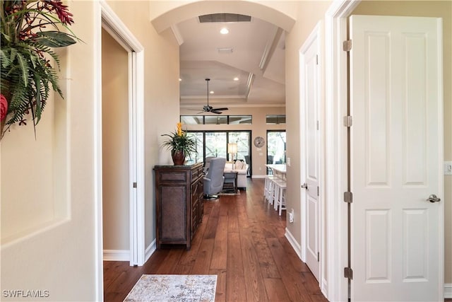 hall with crown molding and dark wood-type flooring