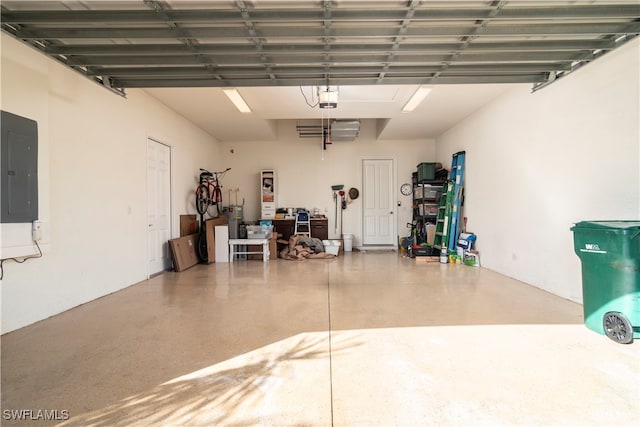 garage featuring a garage door opener and electric panel