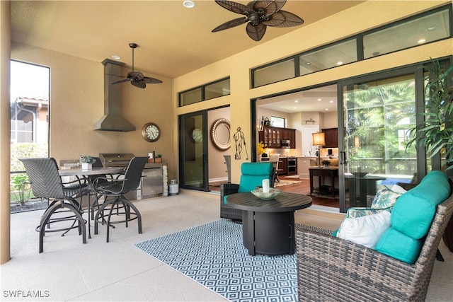 view of patio / terrace featuring ceiling fan and an outdoor living space