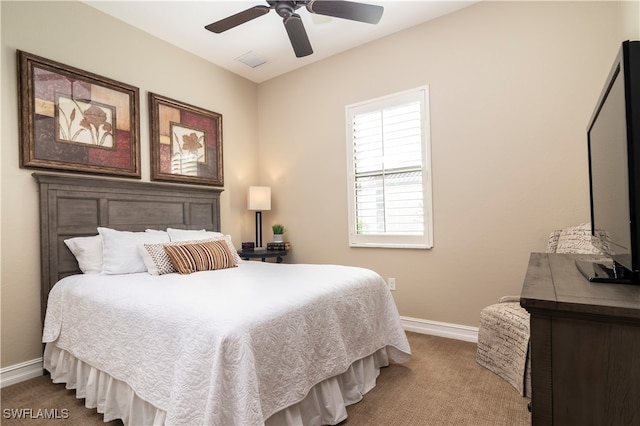 carpeted bedroom featuring ceiling fan