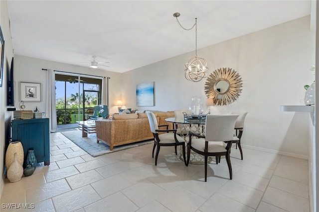 dining space with ceiling fan with notable chandelier