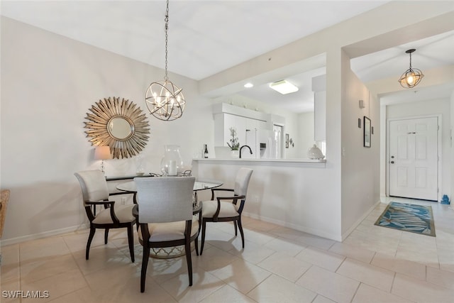 tiled dining area with a chandelier