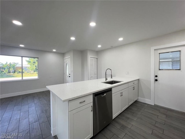 kitchen with white cabinetry, dark hardwood / wood-style floors, sink, dishwasher, and kitchen peninsula