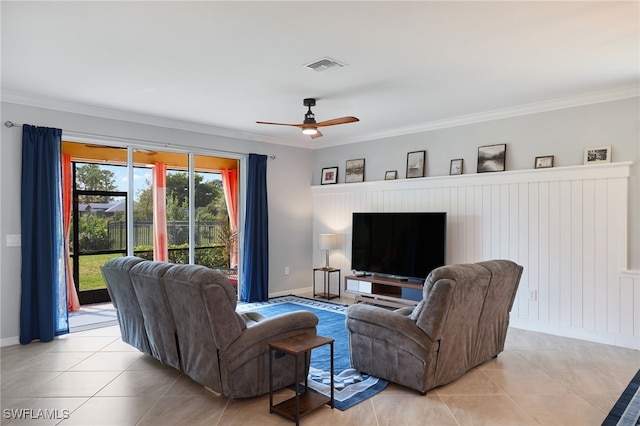 living room featuring crown molding, ceiling fan, and light tile patterned flooring