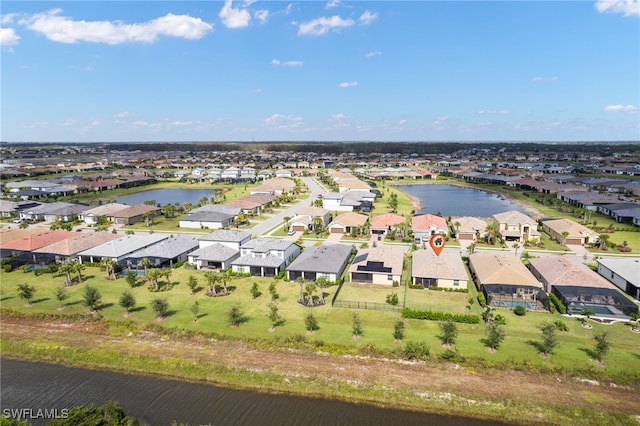 bird's eye view with a water view