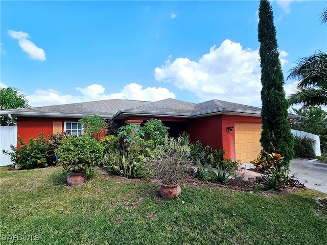 view of front facade with a front lawn and a garage