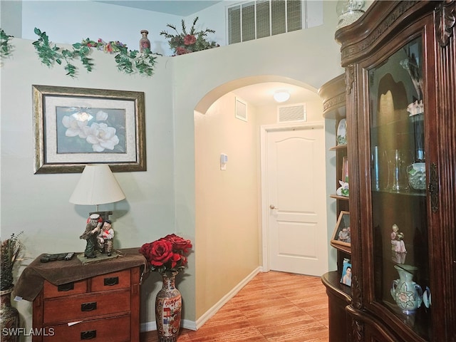 hallway with light wood-type flooring