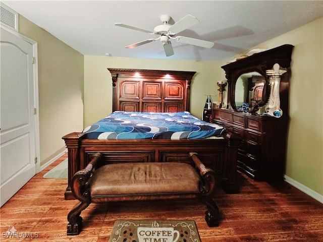 bedroom with hardwood / wood-style floors and ceiling fan