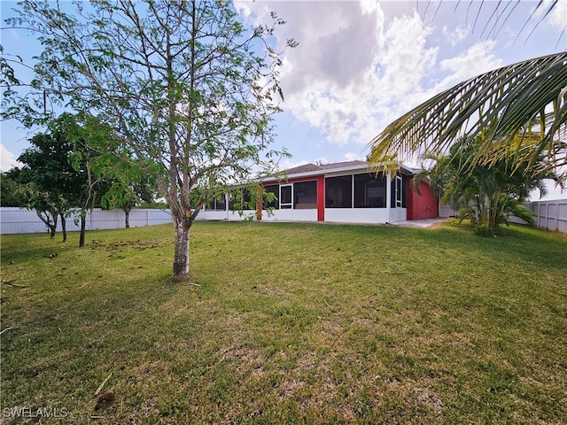 view of yard featuring a sunroom