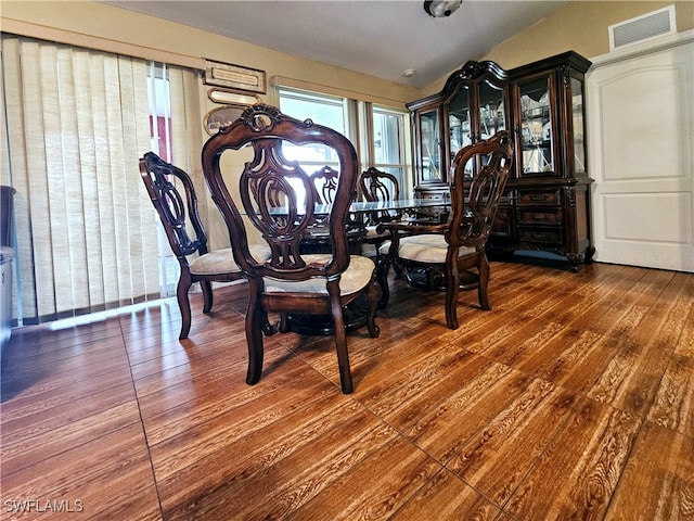 dining area featuring dark hardwood / wood-style floors