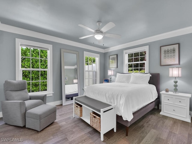 bedroom with hardwood / wood-style flooring and ceiling fan