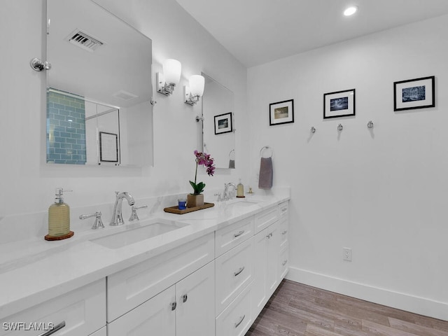 bathroom with vanity and hardwood / wood-style floors