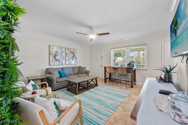 living room with ceiling fan, light tile patterned floors, and ornamental molding