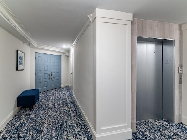 hall with elevator and crown molding