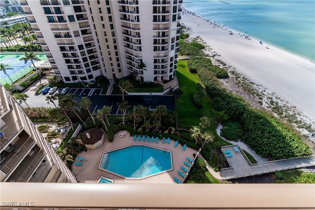 drone / aerial view with a water view and a view of the beach