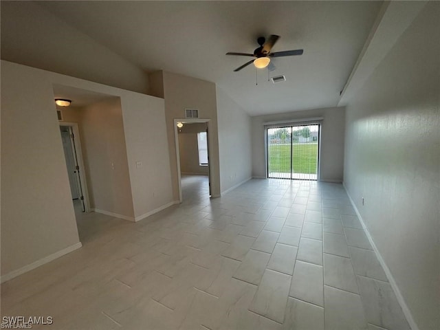 spare room with ceiling fan and lofted ceiling