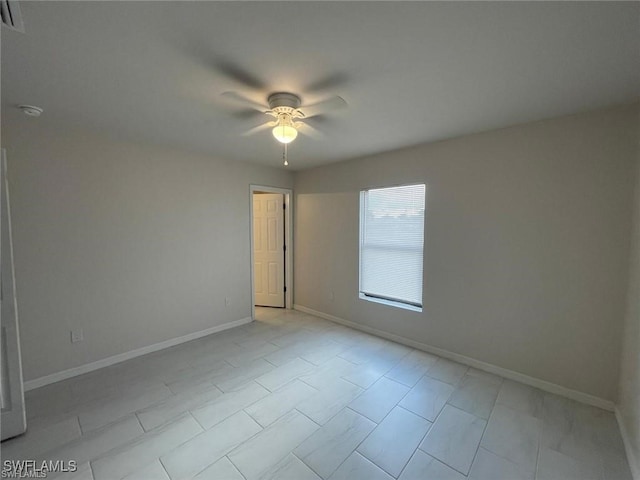 empty room featuring ceiling fan